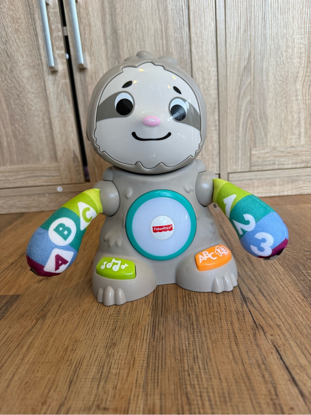 Fisher-Price Gray Sloth Learning Toy with Colorful Patterned Arms